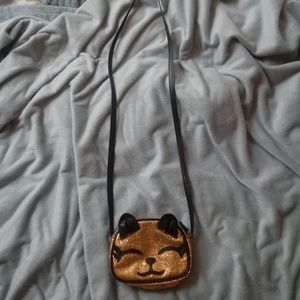 A kitty purse, kitty ears and a headband